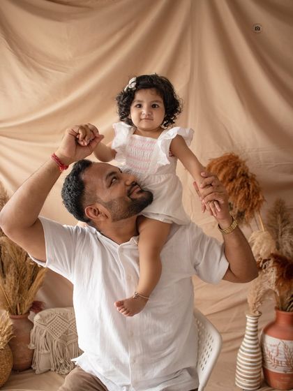 A playful and loving shot of a father with his daughter on his shoulders. These are the candid family moments I love to capture.