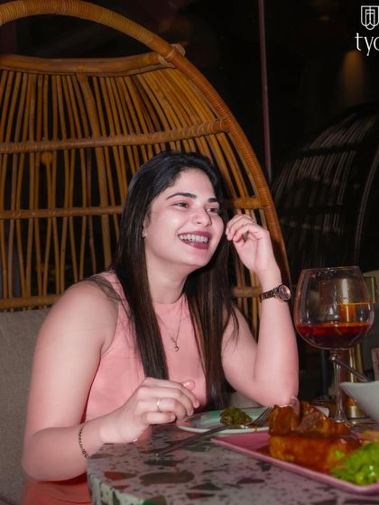 A guest relaxing in one of TYD's stylish wicker chairs. The venue has great spots to chill and enjoy a drink.