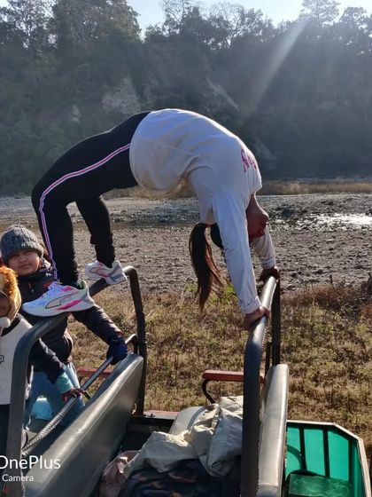 Finding a moment for a quick Chakrasana during a family trip. Yoga can be practiced anywhere, and it's a great way to stretch and reset, even on a jungle safari jeep.