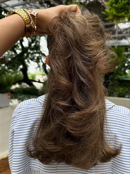 When you need a color refresh, I've got you. I took her faded highlights and toned them to this beautiful, cool-toned brunette, blending everything for a sophisticated and polished finish.