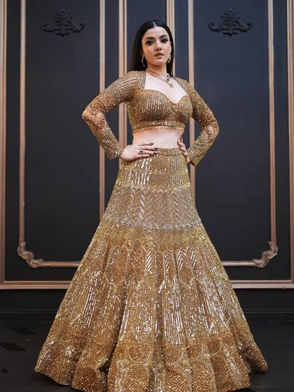 A powerful pose from the campaign. The makeup enhances her strong features and adds to the overall drama of the shot.