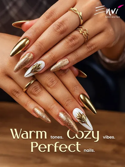 Make a bold statement with these stunning gold chrome and glitter nails. This design is perfect for festive occasions or for any bride wanting a touch of glamour, featuring sharp stiletto shapes and intricate leaf details.