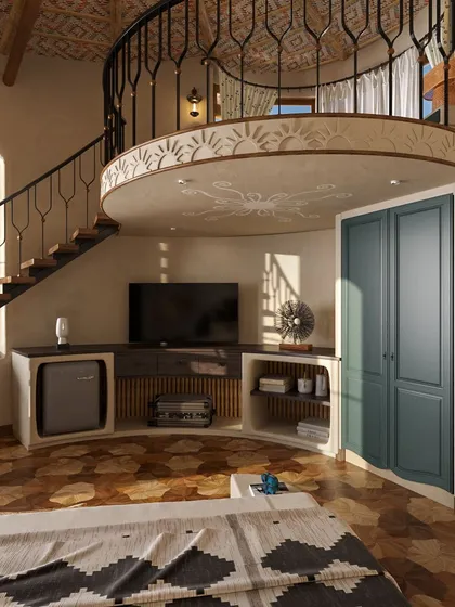 A detail of the custom-built entertainment console and storage unit in the suite. The hand-painted motifs on the mezzanine wall are inspired by local art, adding a unique, cultural touch to the contemporary design.