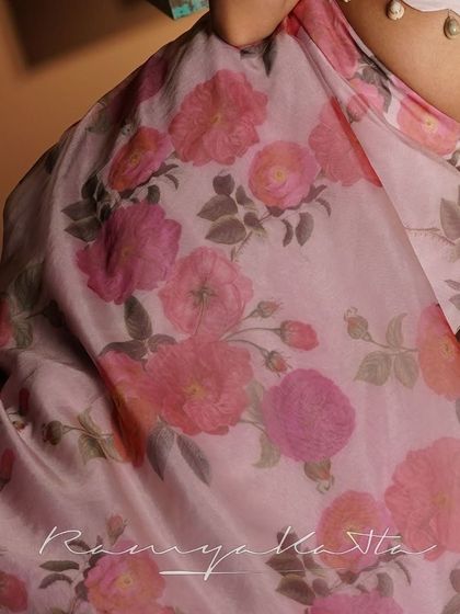 A detail shot of the beautiful rose-printed organza fabric, showcasing its soft colors and texture.