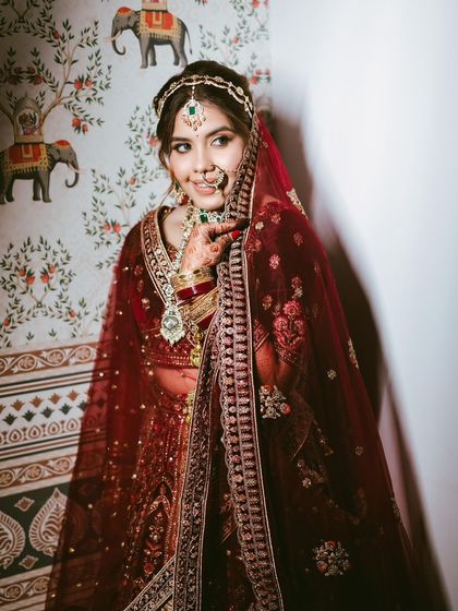 A candid, smiling shot that shows the bride's joy and the beauty of her complete look.