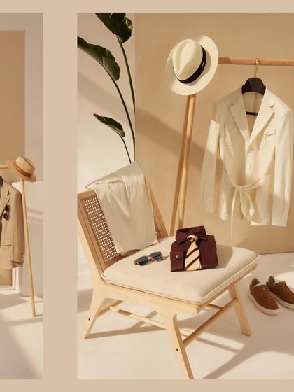 Dive into the season with occasion-wear that embodies freedom. This flat lay showcases a belted white jacket and other summer essentials, all crafted from breathable fabrics for utmost comfort.