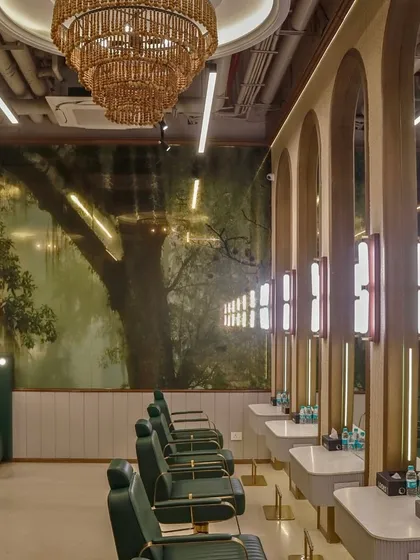 From render to reality, the Looks salon was crafted with great attention to detail. This view of the styling stations shows the arched mirrors and forest mural, a testament to our dedication to transforming a design vision into tangible beauty.
