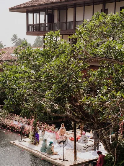 In the serene backwaters of Sri Lanka, we designed this floating mandap to feel like a natural extension of the landscape. The ceremony took place on the water, surrounded by lush greenery and soft florals, creating a peaceful and deeply personal moment for the couple.