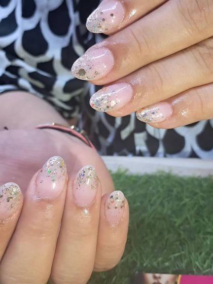 A delicate and sparkly glitter ombre on natural-length nails.