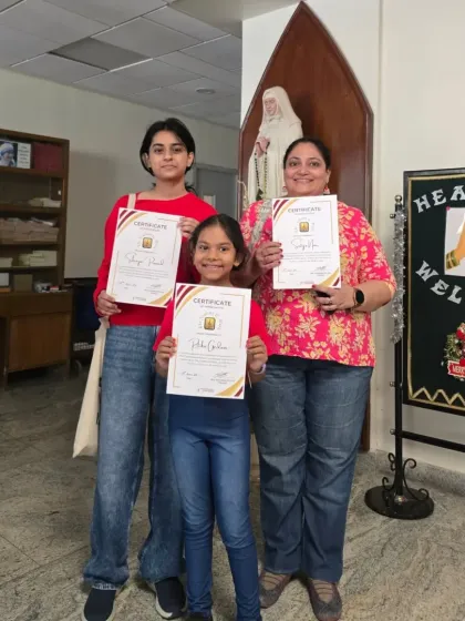 Three of our performers holding their certificates of participation. Every student who takes the stage is a star in our eyes.