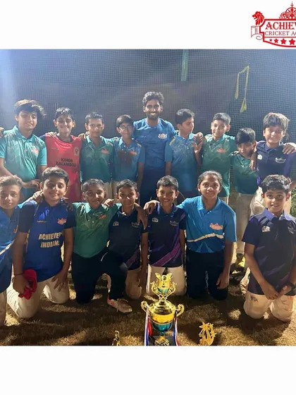 The victorious U-11 squad with their championship trophy and individual awards after the AT Sports Night Tournament.