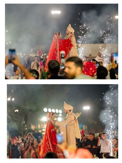 The grand Varmala exchange on a rotating stage, surrounded by fireworks and cheering guests, a truly spectacular wedding moment.