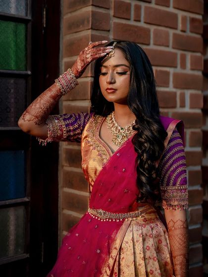 The final henna stain glowing in the sunlight. This image captures the beautiful, warm tones of the matured henna design on the bride's arms.