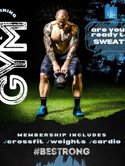 Are you ready to sweat? A member performs a powerful kettlebell swing, a core component of our CrossFit and power training programs designed to build explosive strength and cardiovascular fitness.