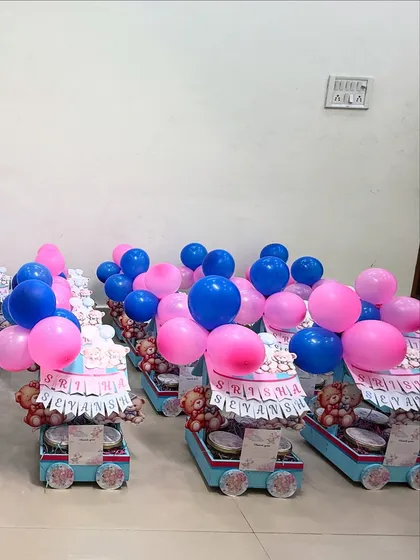 Celebrating twins? We make that extra special! Here are our custom pink and blue teddy-themed cart hampers for Srisha and Sevansh's naming ceremony, complete with balloons to double the fun.