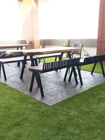 This recently completed project showcases our artificial lawn turf used to create a clean and comfortable seating area on a building's terrace. The turf provides a durable, evergreen surface perfect for outdoor furniture and recreational use.