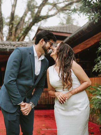 The moment just before a kiss, filled with laughter and anticipation. Akshatha and Jeethesh's pre-wedding shoot was full of such sweet, candid interactions.