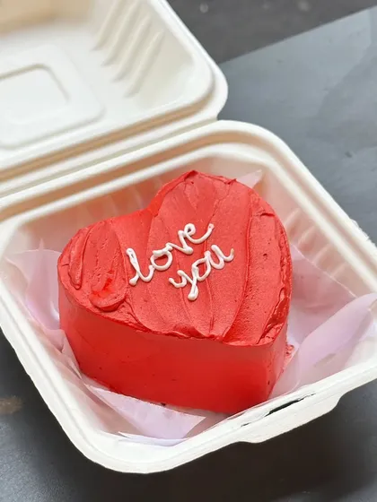 Sometimes the simplest messages mean the most. Our heart-shaped bento cake is perfect for saying "love you" just because. It’s a small cake with a big heart, baked fresh and delivered right to their door.