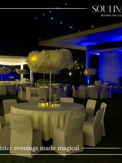 A magical winter evening setup with cloud-like centerpieces, perfect for a corporate year-end party. We create unique and memorable themes for our clients.