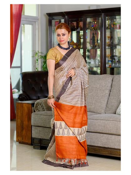 A lifestyle product shoot for a handloom saree brand. The home setting makes the product feel accessible and shows how it can be worn in a real-life context.