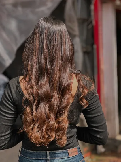The back view of her gorgeous new hair as she walks out of the salon, ready to show it off.