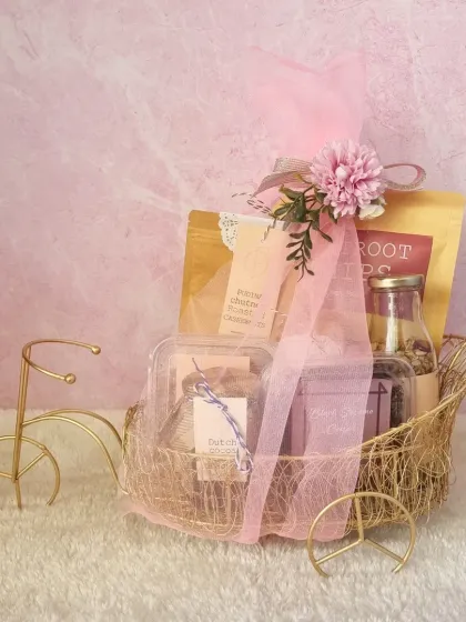 Celebrate with a touch of elegance. This gourmet hamper, presented in a charming golden bicycle basket, is crafted to impress and can be customized for bulk orders.