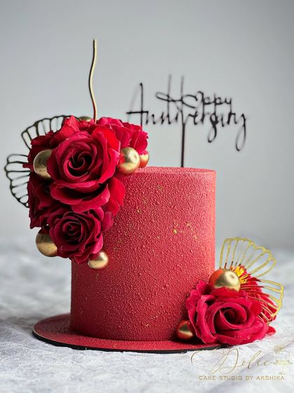 Another look at our stunning red velvet anniversary cake. The texture is created with a special spray technique, giving it a luxurious, velvety finish.