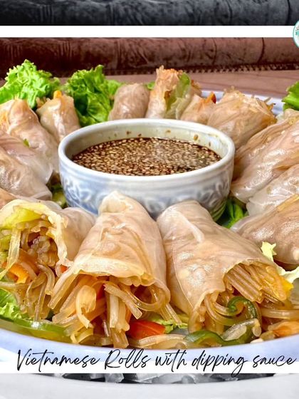 Presenting our Vietnamese Rolls with dipping sauce. This dish consists of fresh vegetables and noodles wrapped in delicate rice paper, a true taste of Vietnam.