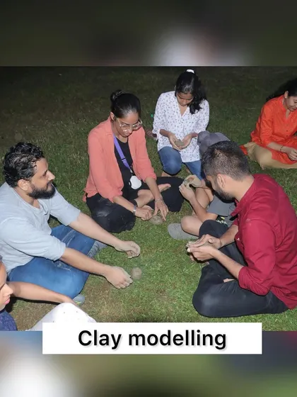 Participants getting creative with clay modeling under the stars at our July meet-up. It's a wonderful way to connect with the earth and unleash creativity.