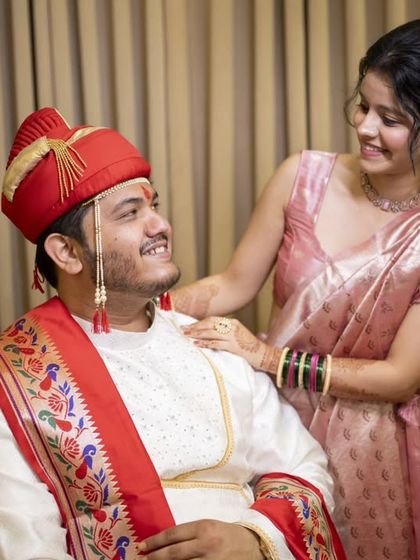 A sweet, candid moment between the groom and his sister, showcasing the importance of family on the wedding day.