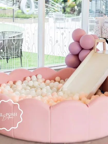 The soft pink, flower-shaped ball pit with a slide was a huge hit at Aahana's "Onderland" first birthday party.