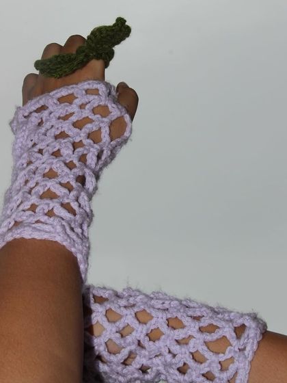 Holding a little crochet sprout while wearing my lavender gloves. It’s all about the small, handmade details.