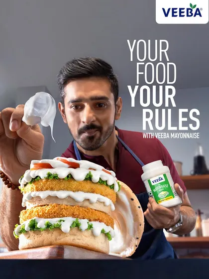The final ad layout for the Veeba Mayonnaise burger shot, incorporating the brand's tagline. This image shows how I create visuals that seamlessly integrate with campaign messaging for a finished, professional look.