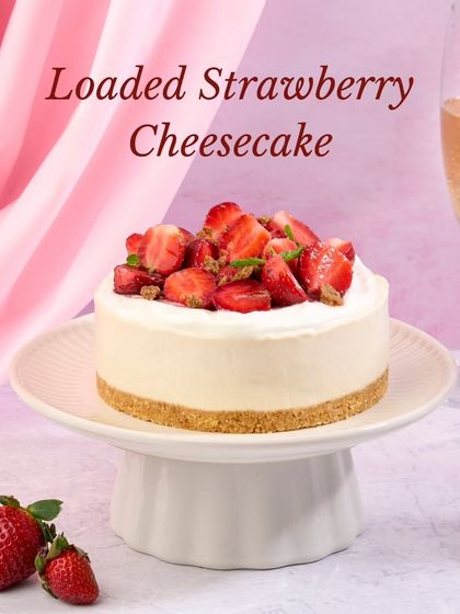 The Loaded Strawberry Cheesecake presented as a mini cake, perfect for a personal indulgence or a small celebration.