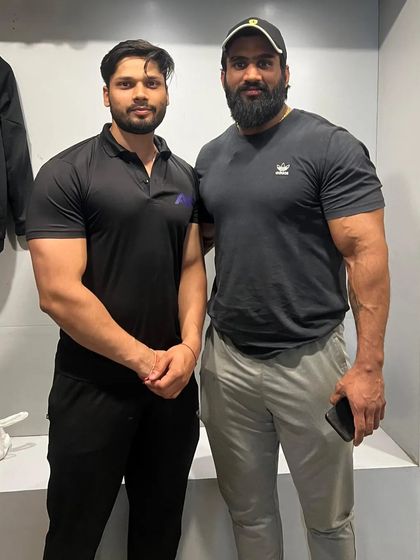 With a fellow lifter. The fitness community is about supporting and inspiring each other.