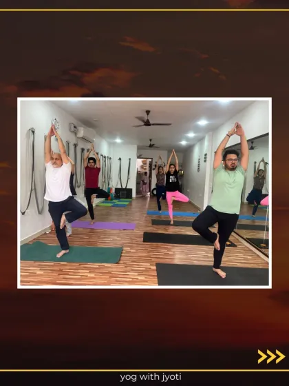 A class of men and women practicing Tree Pose, showing the diversity of our yoga community.