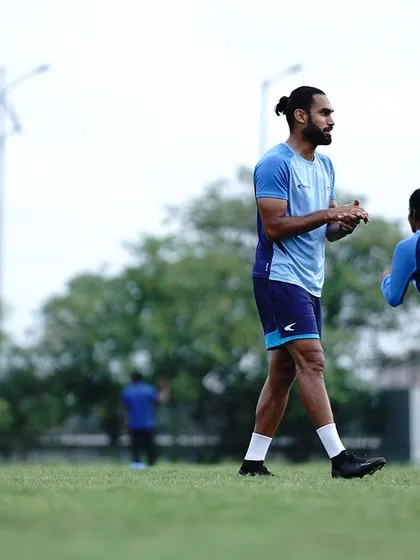 Coaching on the field is about clear communication and observation. Here, I am overseeing a drill, ensuring the athletes are executing the movements with the correct intent and technique to maximize the training effect.