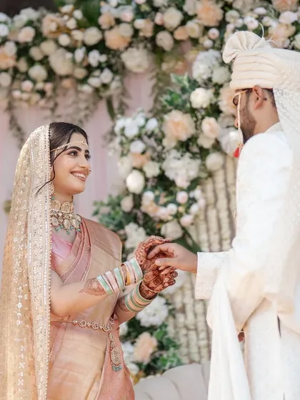 My bride Abha looked absolutely radiant for her Pheras. Her peachy-pink saree and mint green jewelry were so fresh and unique. I created a minimal glam look with a natural, glowy base to enhance her beauty without overpowering her style.