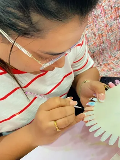 This student is practicing her line work on a practice wheel, an important exercise for improving precision.