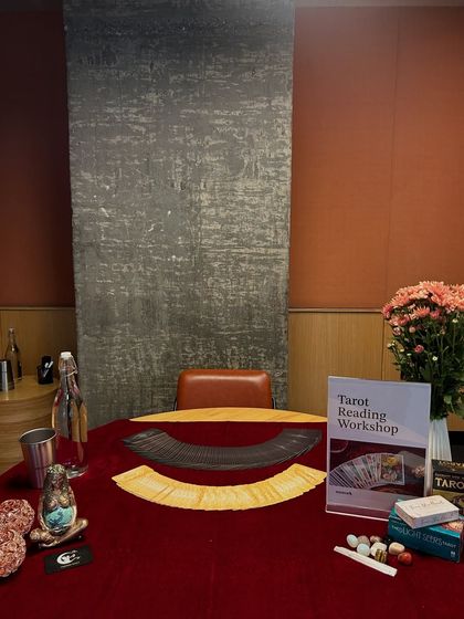 Another angle from my Tarot Reading Workshop at WeWork. The space was set up to feel warm and inviting, with a red velvet cloth, my tarot decks, and a vase of fresh chrysanthemums.