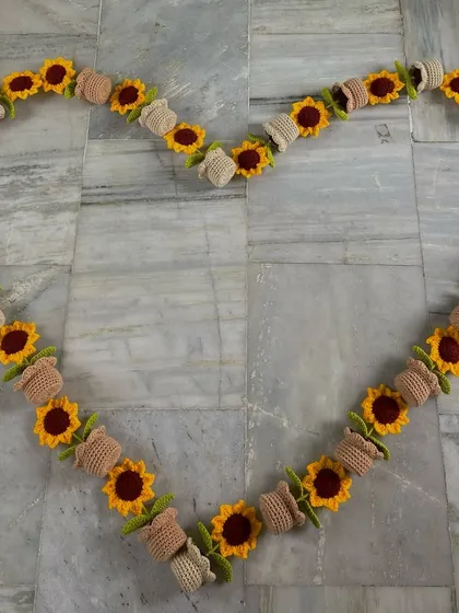 My potted sunflowers arranged in a heart shape, just for fun after finishing a big order.