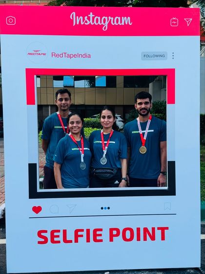 Posing with fellow runners at the selfie point. The running community is full of positive energy and mutual support.