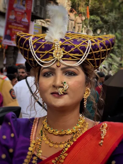 A portrait of a woman in full traditional attire, including a regal pheta. My close-up shots highlight the intricate jewelry and confident spirit of the participants.