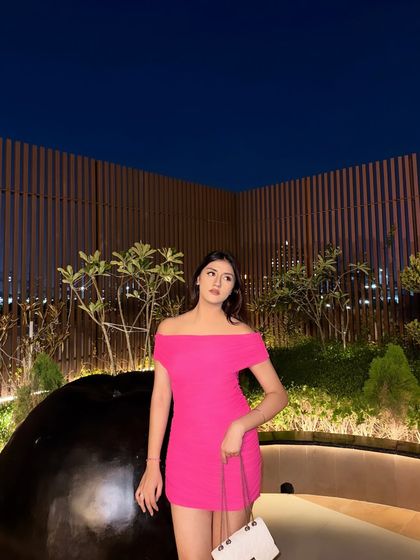 Pink infatuation. A vibrant pink off-the-shoulder bodycon dress for a night out.