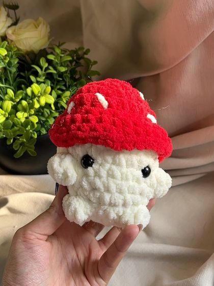 A close-up of our handmade mushroom toy. The soft, plush texture makes it wonderful to hold and cuddle.