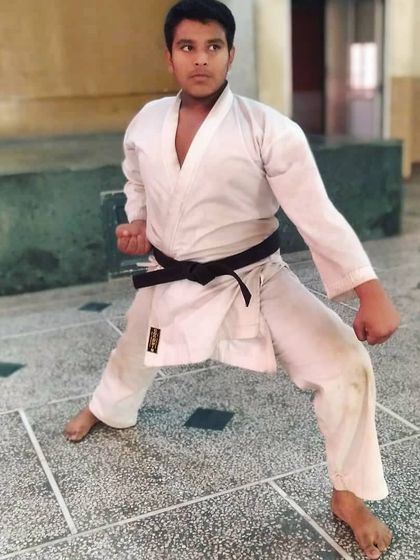 My brother holding a strong Kiba-dachi (horse stance). Discipline and strong basics run in the family.