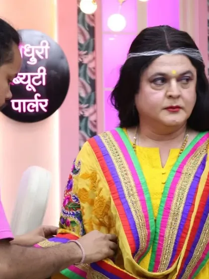 Transforming Ali Asgar sir into his famous 'buwaa' character is always a fun challenge. Here you can see me making final adjustments to the colorful dupatta draping, a key part of creating that funny, over-the-top aunty look for the TV series.