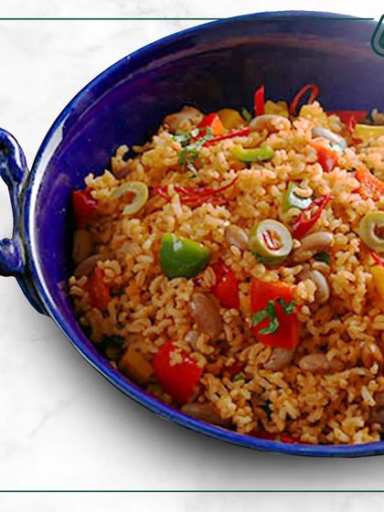 This colorful Mexican-style rice bowl is packed with beans, corn, and fresh vegetables. It's a flavorful and hearty meal that brings a little fiesta to your day.