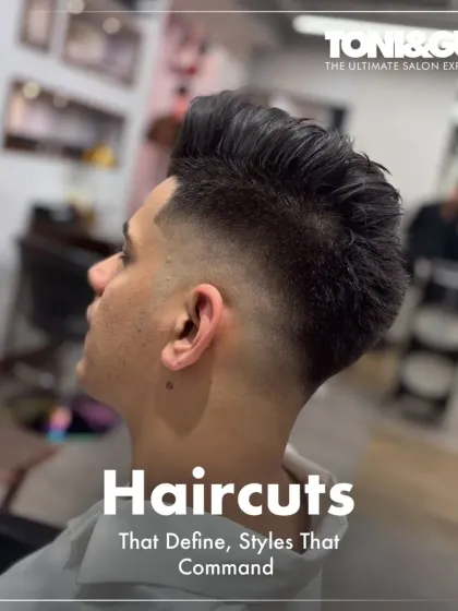 Haircuts that define, styles that command. This image captures a modern, textured style with a high fade, demonstrating the sharp, contemporary looks we create for our male clientele.