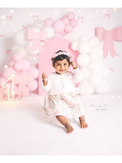 Warning: too much bow-tifulness to handle! This sweet girl's first birthday is celebrated with a lovely pink and white bow-themed setup.